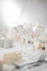 Wine glasses on a table during a wedding dinner