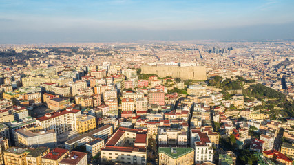 Fototapeta na wymiar Aerial view of the hill and residential district of Vomero in Naples, Italy. Many are the buildings built in the narrow streets of the city.