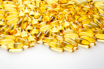  Omega-3 fish fat oil capsules on a white background. 