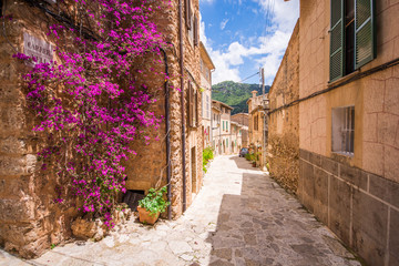 Valldemossa beautifuls streets decorated in plant pots and colorful flowers