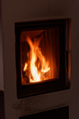Flames in a wood burning stove in a house