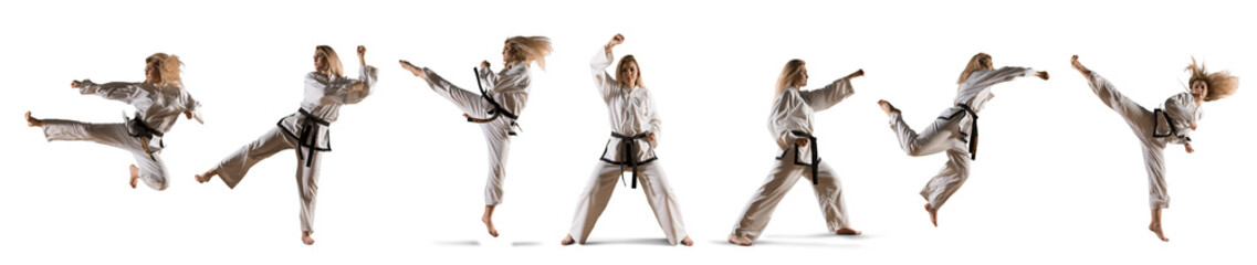 Caucasian female in kimono practicing taekwondo © Andrey Burmakin