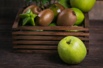 Set of green fruits for healthy diet and detox: apple, lime, kiwi, mango, carambola and mint.