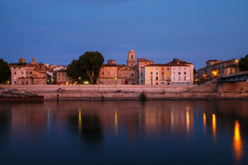 Arles, view to historic town from the river. Twilight, Arles, Provence-Alpes-Cote d'Azur, France.
