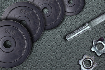 Obraz na płótnie Canvas Dumbbells and weights are lying on the floor in the gym. Barbell set and gym equipment. Metal loads in the fitness club