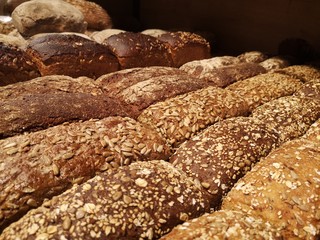 Close-up: fresh bread (pastries) on a shelf in a supermarket