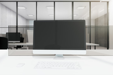 Clean white office with computer