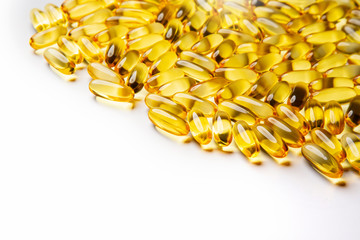  Omega-3 fish fat oil capsules on a white background. 