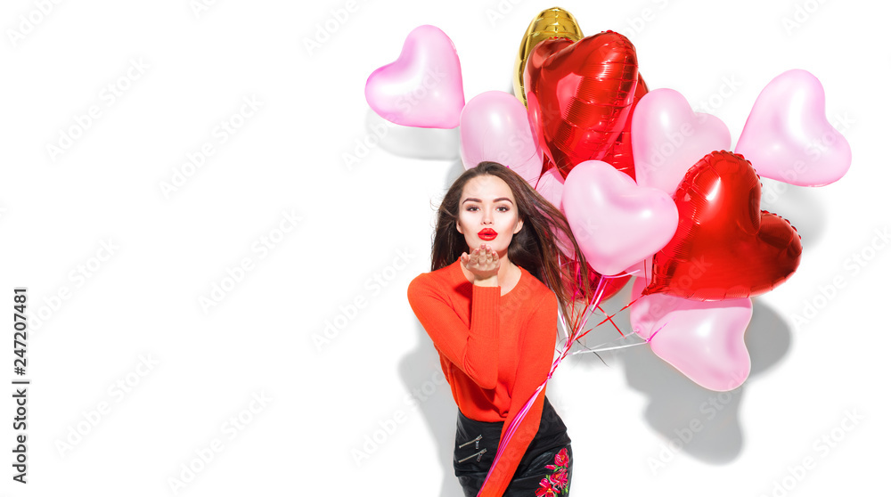 Wall mural valentine's day. beauty girl with colorful air balloons having fun, isolated on white background