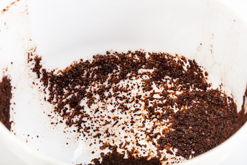 coffee sediments in white porcelain cup close up