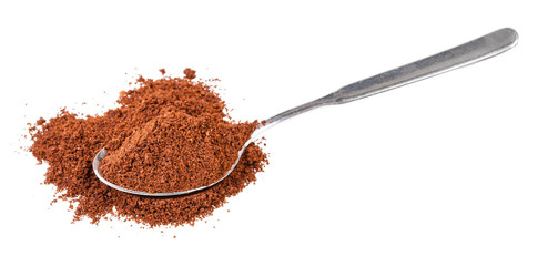 pile of freshly ground coffee in spoon isolated