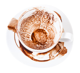 cup on saucer with pattern of carob sediments