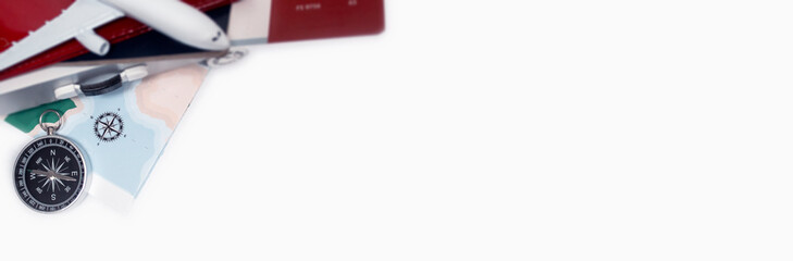 Time to Travel. Idea for tourism with an airplane, passport and tickets, compass and map on a light background. Concept on the theme of flights.