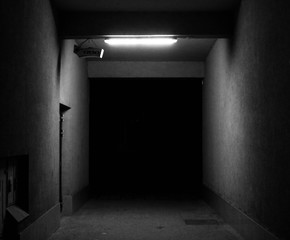 Empty, dark tunnel at night