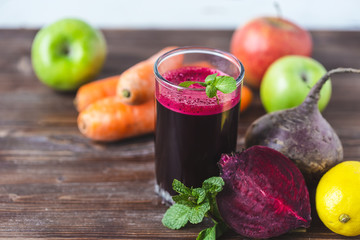 fresh juice from homemade vegetables. Beet smoothie. Detox, vegetarianism On a bright wooden...