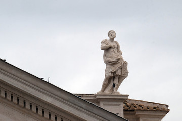 Obraz premium St. Gallicanus, fragment of colonnade of St. Peters Basilica. Papal Basilica of St. Peter in Vatican, Rome, Italy 