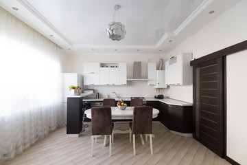 Interior. Kitchen modern, white, brown, beige color, doors
