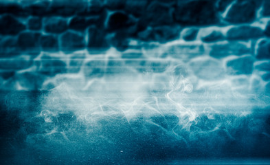 Background of an empty room with brick walls and lanterns. Grunge old brick wall closeup. Neon blue light smoke