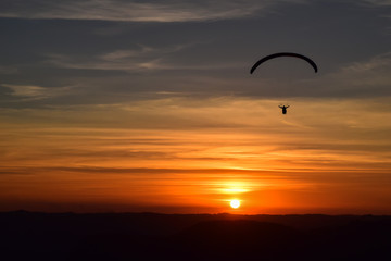 Paragliding on sunset