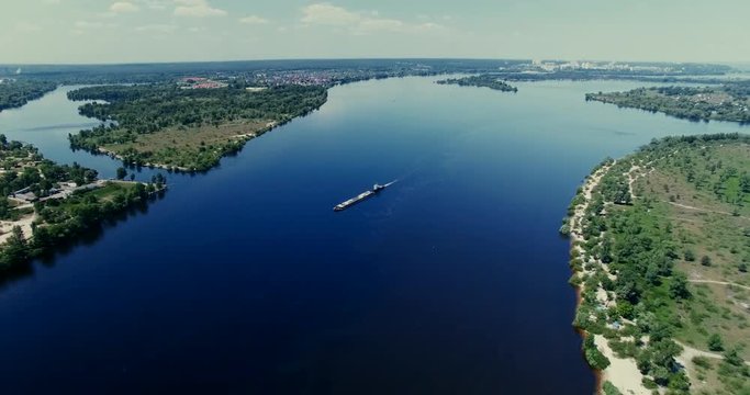 Aerial Barge Floating In River.Drone Ship Passing River.Cargo Barge Floating On Lake.Tug Boat Loaded Sand.Top View Of The Ship Floating On The River.Empty Barge Floating.Container Ship Passing River.