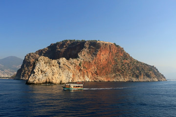 Rocky sea coast with the boat.