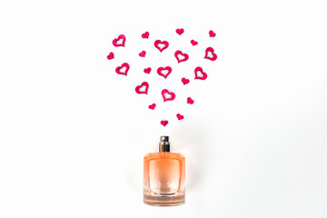 Bottle of perfume with red hearts flying out from it. Valentine's day, choosing fragrance, pheromones.