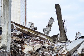 Large concrete piles continue to hold the body of the large concrete buildings, while others look...