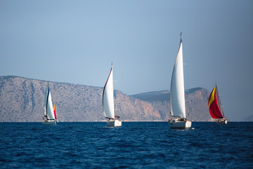 Fototapeta premium Adventure and luxury holiday. Sailing boats in the sail yacht regatta at Aegean Sea.