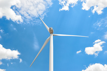 The wind generator is in bright cloudy sky. Eco energy concept.