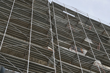 new building under construction, scaffolding and concrete