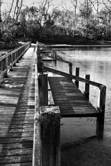 wooden bridge over frozen lake