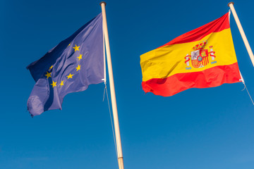 Eu and Spanish flags side by side. Europe Union flag.