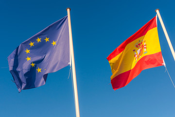 Eu and Spanish flags side by side. Europe Union flag.