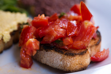 Tomato bruschettas, vegetarian bruschettas.