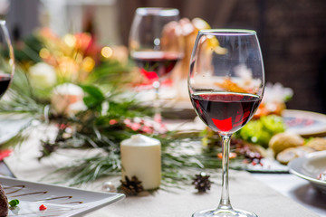 festive served table with food and glasses of wine