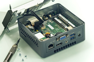Opened single-board personal miniature computer with digital ports isolated on white.