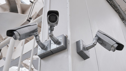 cctv camera security on pole and cement background