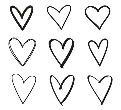 Hand drawn grunge hearts on isolated white background. Set of love signs. Unique image for design. Black and white illustration. Sketchy elements for design