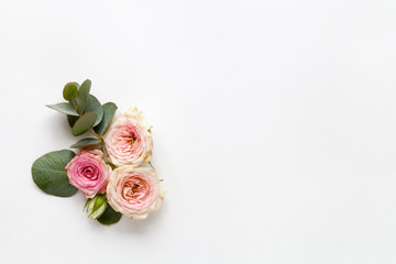 Spring white background with roses. Top view.