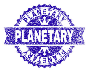 PLANETARY rosette seal imitation with grunge style. Designed with round rosette, ribbon and small crowns. Blue vector rubber print of PLANETARY tag with grunge style.