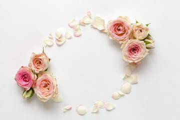 Spring white background with roses. Top view.