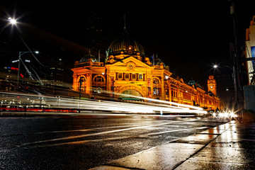Flinders street station with light trails by night, melbourne, austalia