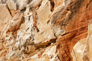 Natural texture of red rocks. Cracked and weathered natural stone background
