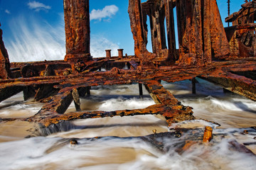 Close up of water flowing through rusty shipwreck of SS maheno at fraser island, queensland, australia