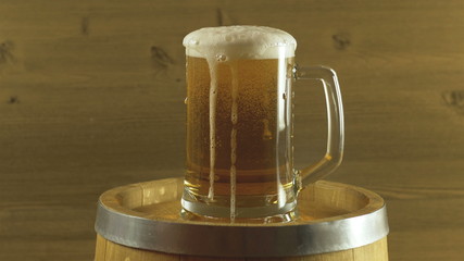 Oktoberfest beer barrel and glass on wooden table