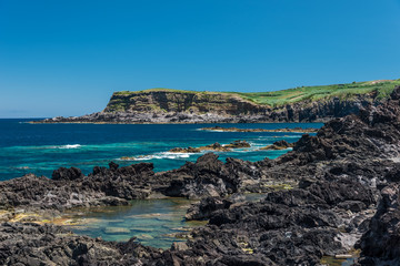 natural pool  in terceria, view of the rocky seaside in terceira with natural pool to have a bath, seascape in azores, portugal.