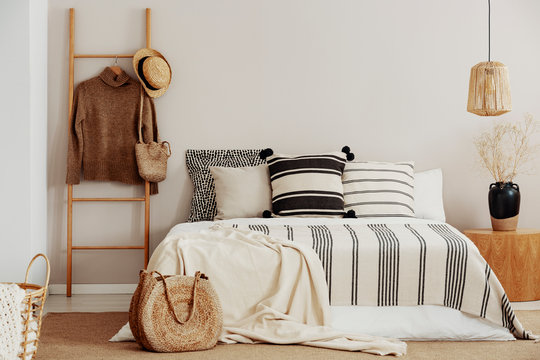 Monochromatic Bedroom With Wooden Accents