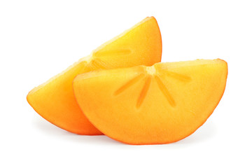 slice of Persimmon fruit with leaves isolated on white background close-up