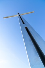 Iron cross statue on the meadow above the city. Zilina, Slovakia