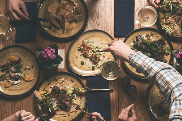People eat healthy meals and drink alcohol festive table 